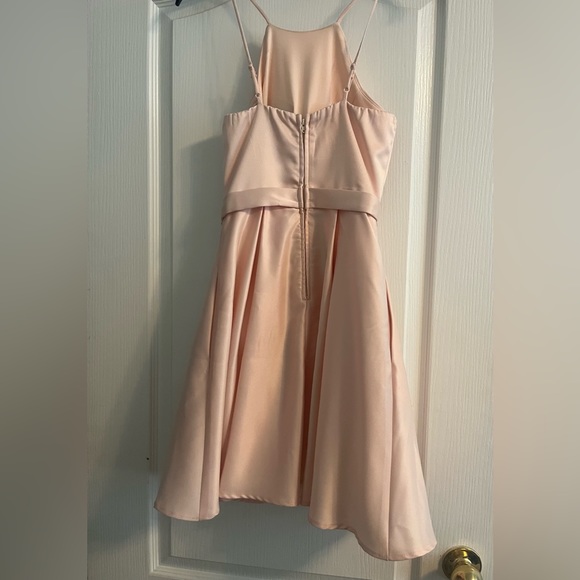 Size 0 super cute light pink mini dress. Halter top, fits according to size - Picture 2 of 3